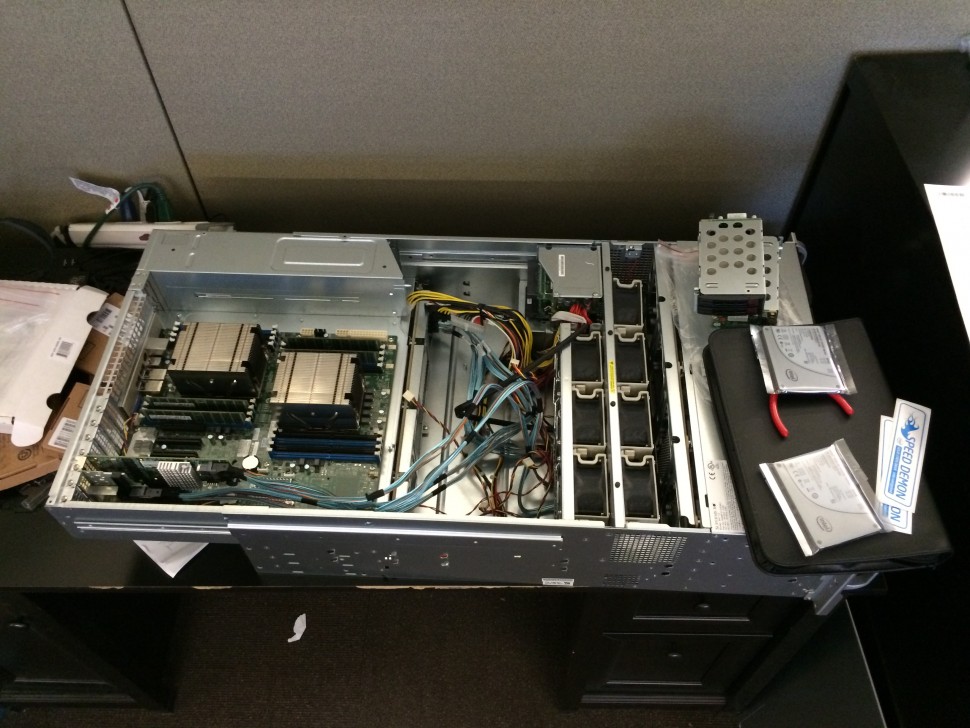 The server mid-assembly in our office. The server contains 12 of the drives pictured earlier in a RAID 6 configuration for a total of 80TB of storage. The remaining four drives from the picture are set aside as spares. The server also contains two Intel SSDs (seen on the right side of this photo) in a RAID 1 configuration running the server's operating system.
