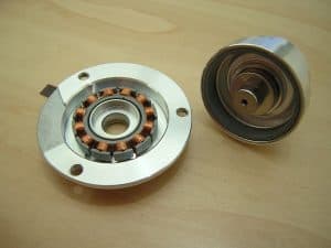 This hard drive spindle motor has been taken out of the chassis and has had its bearings removed.