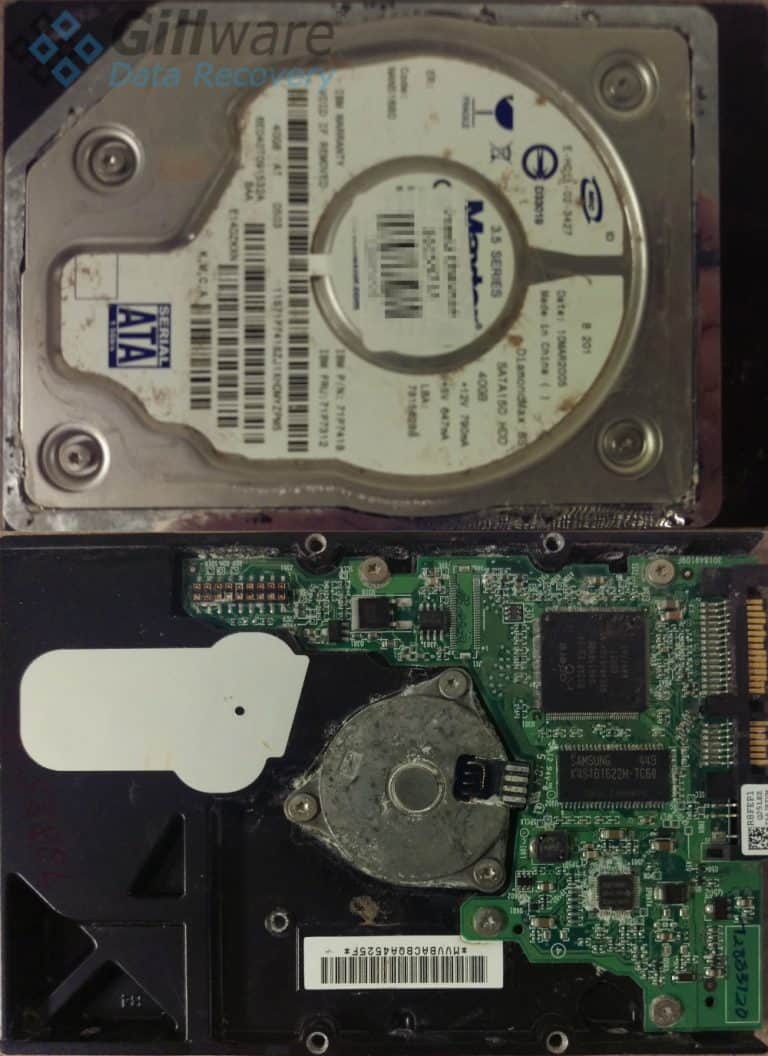 Front and back of hard drive with water damage