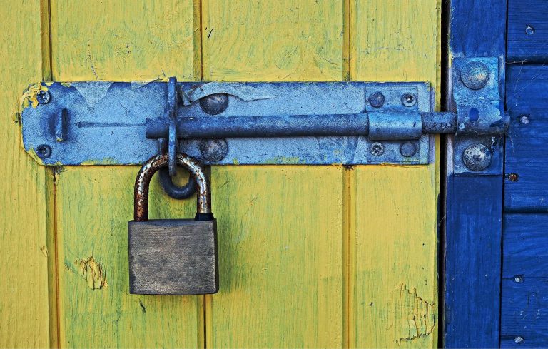 Padlock on barn door, representing how to safeguard against cyber attacks