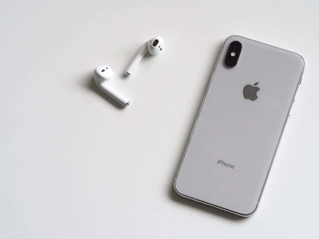 Silver iPhone with Airpods