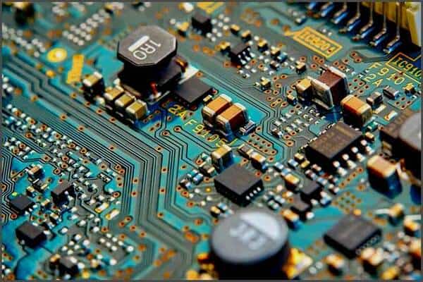 gillware-data-recovery-moores-law-is-dead-pcb-close-up-transistors-moores-law